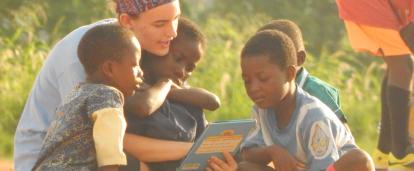 A volunteer reading to children at her Childcare Project in Ghana A Projects Abroad volunteer reading to children at her Spring Break Childcare Project in Ghana